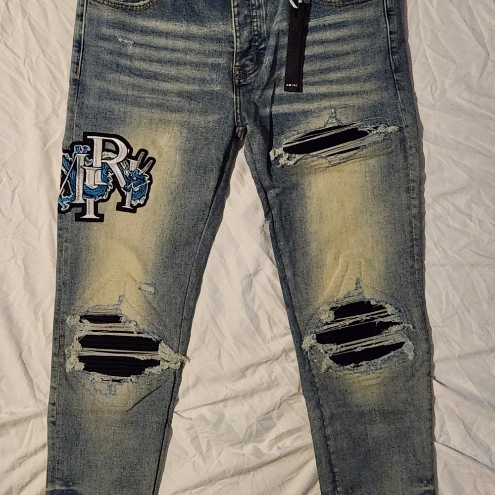 AMIRI Blue Distressed Skinny Jeans with Black Accents